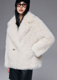 This season, stay warm and toasty in a foxy winter coat! This super soft faux fox fur coat for women is a must-have for any stylish gal! Featuring a classic two button design, you'll be ready to take on chilly weather—no matter how foxy it gets! Faux fox fur Front button closure Notched lapels Dry clean Women's winter jacket/coat Item #310307 Size info XS=US2=UK6=EU32 S=US4-6=UK8-10=EU34-36 M=US8-10=UK12-14=EU38-40 ★★ It would be helpful if you provided your height and weight so that I could ass Winter White Faux Fur Coat For Fall, Elegant Fluffy Mink Outerwear, Fluffy Winter White Fur Coat For Fall, Winter Faux Fur Coat With Button Closure, Faux Fox Fur Coat, Coat For Women, Fox Fur Coat, Chilly Weather, Winter Jackets Women