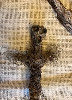 an old crucifix made out of twigs