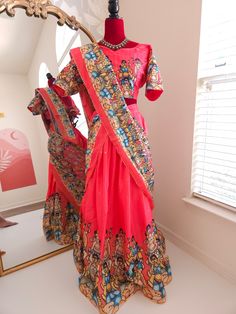 Elevate your ethnic wardrobe with our exquisite Dola Silk Kalamkari Lehenga. This luxurious ensemble combines the rich texture of Dola silk with the timeless beauty of Kalamkari art, making it perfect for festive occasion and wedding Blouse will have 3 to 5 inches of extra allowance Model is wearing size XL or 42 size. Disclaimer:The actual color may vary slightly due to different screen calibration.Since this product is handwoven, there might be slight irregularities and unevenness in the weave, pattern or selvedge. But isn't it wonderful that nobody else will ever own this beauty, handcrafted just for you