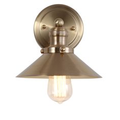 an antique brass finish wall light with a bulb on the side and a white background