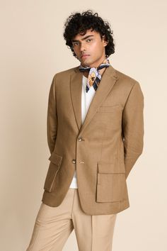 Khakhi blazer in a linen base with notch lapel collar, 2 cargo pockets, 1 barchetta pocket and loop detail at the collar.
Components: 1
Neckline: Notch Lapel
Sleeve Type: Long
Fabric: 100% Linen
Color: Beige
Other Details: 
Vented back
Sleeves with button closure
Unlined jacket
Closure: Button front
Note: The scarf, inner T-shirt and pant worn by the model is not for sale
Occasion: Cocktail and Reception - Aza Fashions Business Linen Outerwear With Pockets, Linen Outerwear With Patch Pockets And Suit Collar, Business Casual Linen Outerwear With Patch Pockets, Linen Outerwear With Patch Pockets For Business Casual, Fitted Linen Blazer With Pockets, Linen Business Blazer With Welt Pockets, Tailored Linen Blazer With Welt Pockets, Business Linen Blazer With Welt Pockets, Linen Blazer With Notch Lapel And Pockets