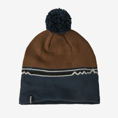 Even on the coldest days, a steep trail run or a strenuous lead can give you a head of steam, so we designed the Lightweight Powder Town Beanie for high-output mountain pursuits in a weight that’s just right for going fast. Made from soft, comfortable recycled polyester, it stays dry when you’re facing a squall, insulates even when wet and feels smooth and itch-free on the skin. The textured knit construction includes a handy cuff that can be worn up in warmer conditions or down when you need more protection. With a classic pom-pom—just because! Fair Trade Certified™ sewn, which means the people who made it earned a premium for their labor. | Patagonia Lightweight Powder Town Ski Beanie in Shelter Brown - Winter Beanies - Recycled Polyester/Pfas Winter Beanies, Winter Beanie, Pom Beanie, Textured Knit, Cold Day, Fair Trade, Patagonia, Skiing, Pom Pom