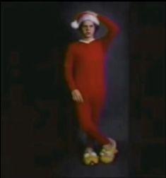 a woman in a red dress and santa hat