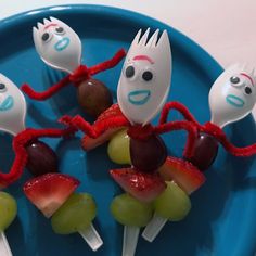 there are some fruit skewers with faces on them