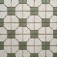 a white and green tiled floor with small square tiles on the top, bottom and bottom