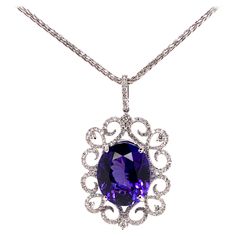 This stunning tanzanite is set in a gorgeous, symmetrical diamond setting that further highlights the top quality tanzanite. The meticulous details involved in this setting truly catches everyone's attention. Tanzanite: 18.80 cts, Oval shape Diamonds: 1.53 cts, Round Brilliant Metal: 18k White Gold **Comes with a 14k White Gold Chain 16 inch length*** Luxury Tanzanite Fine Jewelry For Wedding And Engagement, 1stdibs Jewelry, Tanzanite Pendant, White Gold Chain, Diamond Rings Design, Key Jewelry, Tanzanite Diamond, Jewelry Lookbook, Girly Jewelry