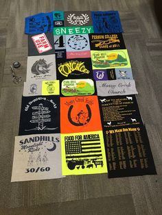 several t - shirts are laid out on the floor