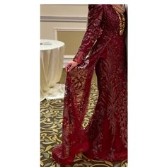 Beautiful Dark Red Long Sleeve Formal Gown With A Side Skirt For An Elegant Look! Great Quality And Only Worn For 2 Hours Inside. No Tears And Stains And All Beads Are Still In Tact. Size 6 My Sizing Is 36 Inch Bust And I’m 5.5 And Wore 4 Inch Heels. It’s Easy To Hem If Too Long. I Weigh 125 Pounds And It Fit Perfectly. Red Sequined Dress For Wedding, Red Embellished Gown For Formal Occasions, Red Embellished Long Sleeve Gown, Long Sequined Dress For Wedding, Red Embellished Gown For Gala, Red Embellished Long Sleeve Evening Dress, Red Long Sleeve Embellished Evening Dress, Burgundy Floor-length Evening Dress, Red Sequined Gown For Gala