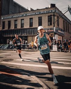 two men running in a marathon on the street