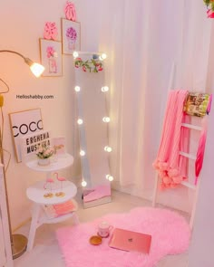 a room with pink rugs and lights on the walls