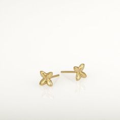 These are small gold earrings, gold flower studs. They are handmade of yellow 14k solid gold and have a shiny finish. Tiny and classy, these earrings are perfect for every day wear and will always be in style. A wonderful gift for yourself or for someone you love.14k solid gold ear backs are included.Size of the earrings is 5.3 x 5.8 mm = approx 0.2 x 0.22 inch* The earrings will be packed in a gift box ready to give as a gift *If you want to see more gold earrings click here: https://www.etsy.c Dainty Yellow Gold Flower Earrings, Delicate Tiny Gold Flower Earrings, Dainty 14k Gold Flower Earrings, Gold Minimalist Flower Earrings For Everyday, Minimalist Gold Flower Shaped Earrings, Delicate Hypoallergenic Yellow Gold Flower Earrings, Minimalist Flower Earrings For Anniversary, Minimalist Flower-shaped Earrings For Anniversary, Delicate Yellow Gold Flower Shaped Earrings