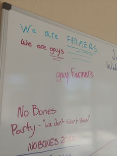 a white board with writing on it in front of a wall that says we are farmers