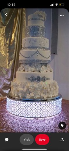 a white wedding cake sitting on top of a table