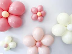 some balloons and flowers on a table