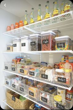 a refrigerator filled with lots of food and labeled labels on it's shelves in a kitchen