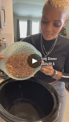 a woman holding a bowl with food in it