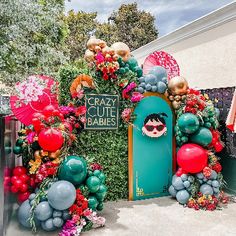 the entrance to crazy cute babies is decorated with balloons