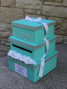 there are three boxes that say cards on the front and one has a bow at the top