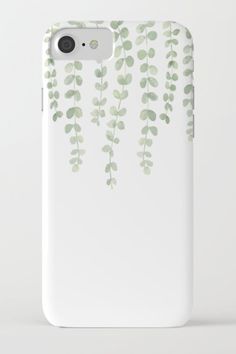 a white phone case with green leaves on it