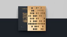 a brochure designed to look like an intricate pattern with gold foil on it