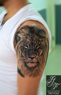 a man with a lion tattoo on his arm