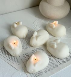 some candles that are sitting on top of a piece of paper