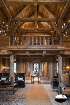 a living room filled with lots of furniture next to a tall wooden ceiling mounted chandelier