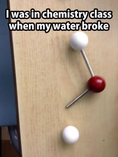 an image of a wooden table with two balls on it and the words i was in chemistry class when my water broke