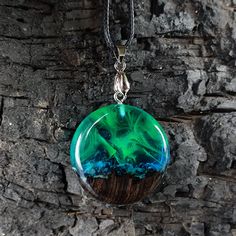 Aurora borealis necklace, northern lights pendant, green opal necklace, resin aurora pendant, glowing necklace, birthday gift, gift for her Everything is made naturaly from wood, resin and inspire, we use rare types of tropical woods which has miracle grain and put with resin to make inspiring jewelery. The resin has doesnt effect from water, so you can swim in the sea or pool as you wish. İf needed you may clean this piece with dry soft cotton cloth or you can care wood with olive oil or someth Yin And Yang Necklace, Aurora Northern Lights, Ying And Yang, Yin Yang Necklace, Glowing Necklace, Necklace Resin, Couple Necklaces, Green Opal, Wood Resin