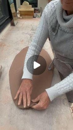 a man is working on an object in the process of making something out of clay