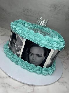 a cake decorated with photos and a tiara on top is shown in the shape of a princess's crown