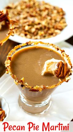 pecan pie martini is garnished with whipped cream and pecans