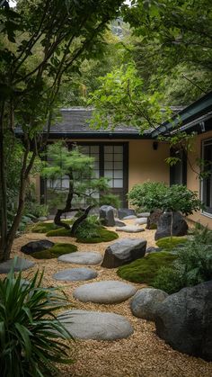 a japanese garden with rocks and trees