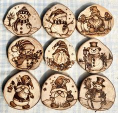 six wooden buttons with snowmen on them