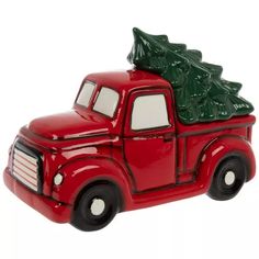 a red truck with a christmas tree on the back