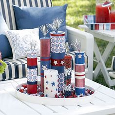 an outdoor table with patriotic decorations on it