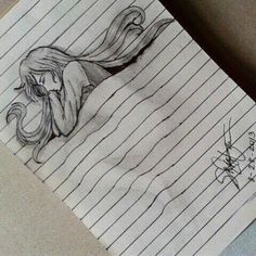 a drawing of a mermaid with long hair sitting on top of a sheet of paper