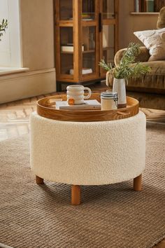 a coffee table with two cups on it