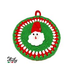 a crocheted christmas ornament with a santa clause on it's face