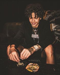 a man sitting at a table with some food