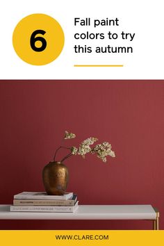 a vase with flowers sitting on top of books in front of a red wall and text that reads, 6 fall paint colors to try this autumn