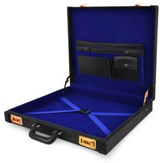 an open black suitcase with blue linings on the bottom and inside, sitting in front of a white background