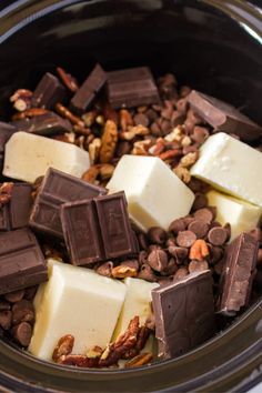 chocolate and nuts are mixed together in a slow cooker to make an easy snack