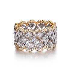 two tone gold and white diamond ring with an intricate design on the center, surrounded by smaller diamonds