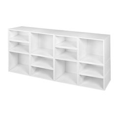 a white shelf with several shelves on each side