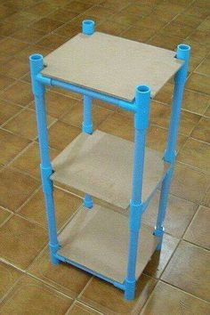 a blue and white shelf sitting on top of a tile floor next to a tiled floor