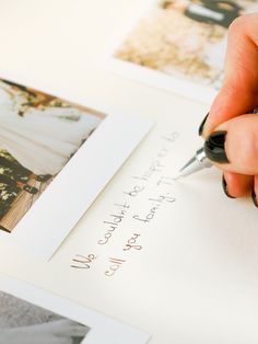 a person writing on a piece of paper with a fountain pen in their left hand