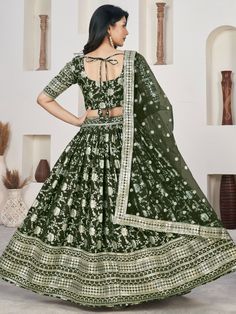 Elegance meets allure in this enchanting green jacquard lehenga ensemble, adorned with opulent zari embroidery and shimmering sequin work. The verdant green hue exudes vibrance and sophistication, making it an exquisite choice for weddings, celebratory events, and special occasions. Crafted from luxurious jacquard fabric, the semi-stitched lehenga offers a comfortable fit of up to 42 inches, ensuring both style and ease of movement throughout the festivities.
Complementing the resplendent leheng Green Art Silk Anarkali Set With Intricate Embroidery, Green Art Silk Choli With Intricate Embroidery, Green Lehenga With Intricate Embroidery For Festive Occasions, Bollywood Green Lehenga With Intricate Embroidery, Festive Green Lehenga With Intricate Embroidery, Green Art Silk Sets With Intricate Embroidery, Anarkali Green Lehenga With Intricate Embroidery, Green Semi-stitched Meenakari Choli, Green Lehenga With Resham Embroidery For Festive Occasions