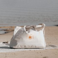 Chase the Sun Recycled Woven Beach Bag, Eco, Recycled canvas, Beach Bag, Unisex, Recycled  Cotton, Pineapple Island The Chase the Sun Recycled Woven Beach Bag is the perfect accessory for carrying your summer essentials in style. An ideal weekender tote, this large bag is practical AND trendy, big enough to hold beach towels, yoga mats and picnic blankets!    Details - Recycled canvas bag.  - Measurements: Height 37cm, length 49cm, width 14cm, strap length 70cm.  - 80% recycled cotton and 20% recycled polyester. - Long handles with reinforced cross stitch for strength. - Illustrated by Lauren Spinner. - Made in the UK, at a local Bournemouth print house. Please refer to the additional images for the sizing guide.  Chase the Sun Recycled Woven Beach Bag, Eco, Recycled canvas, Beach Bag, Uni Summer Beach Bag Aesthetic, Woven Beach Bag, Recycle Tote Bag, Recycled Tote, Boho Tote Bag, Quote Tote Bag, Knitting Tote Bag, Thoughtful Gifts For Her, Picnic Blankets