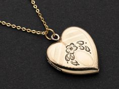 "Pictured is a vintage heart locket in yellow gold filled. Typically these antique lockets are hallmarked with the either a 1/20th 14K GF or 1/20th 12K GF stamping.  Please See photos for condition. May contain old pictures, that can easily be removed if needed. THIS IS A ONE-OF-A-KIND LISTING AND YOU WILL RECEIVE THE ITEM(S) IN THE PICTURES. EVERYTHING IS UNTESTED AND IS SOLD AS \"ART SUPPLIES\" AND NOT INTENDED FOR THE ORIGINAL PURPOSE. THESE ITEMS MAY HAVE SMALL PARTS THAT MAY BE A CHOKING HAZARD. THE ITEM(S) IN THIS LISTING ARE FOR ADULT USE OR TO BE USED UNDER THE SUPERVISION OF AN ADULT." Collectible Heirloom Necklace For Valentine's Day, Hallmarked Locket Necklace For Valentine's Day Wedding, Hallmarked Locket Necklace For Wedding On Valentine's Day, Victorian Jewelry With Hallmark For Valentine's Day, Antique Gold Vintage Charm Jewelry For Valentine's Day, Vintage Yellow Gold Heart Jewelry, Vintage Yellow Gold Locket Necklace For Anniversary, Antique Yellow Gold Locket Necklace For Valentine's Day, Valentine's Day Antique Gold Vintage Charm Jewelry